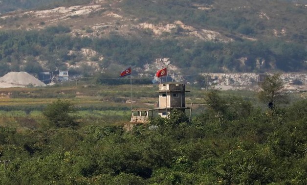FILE PHOTO - A North Korean flag flutters at a guard post near the propaganda village of Gijungdong in North Korea, in this picture taken near the truce village of Panmunjom, South Korea, September 28, 2017. REUTERS/Kim Hong-Ji