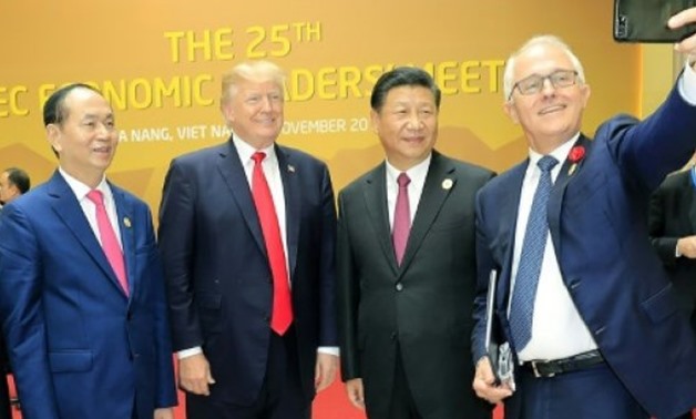US President Donald Trump poses for a selfie with Australia's Prime Minister Malcolm Turnbull, Vietnam?s president Tran Dai Quang and China's President Xi Jinping in Danang, Vietnam - APEC 2017 National Committee/AFP / by Jerome CARTILLIER | 