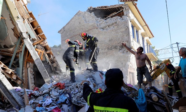 Searching for survivors in the rubble of a collapsed building in Vrissa - Reuters/Credit Giorgos Moutafis