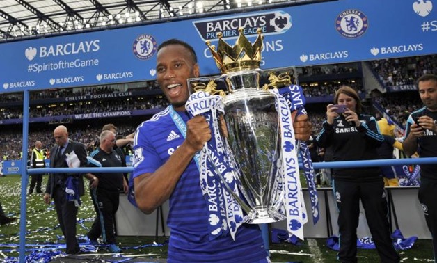 Chelsea's Didier Drogba celebrates with the trophy after winning the Barclays Premier League - Reuters / Dylan Martinez