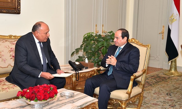 File - President Abdel Fatah al-Sisi with Foreign Minister Sameh Shoukry