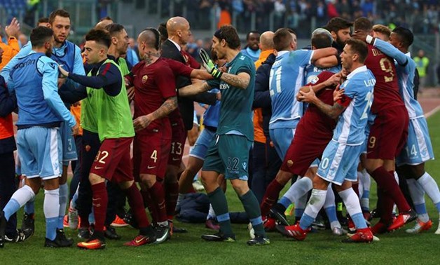 Lazio's and AS Roma's players argue during the match -
 REUTERS/Alessandro Bianchi