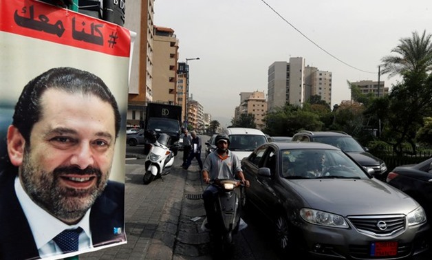 Posters show Lebanese prime minister Saad al-Hariri, who announced his resignation from Saudi Arabia, are seen in Beirut, Lebanon, November 13, 2017 -
 REUTERS/Mohamed Azakir