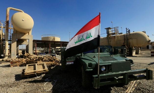 An Iraqi flag is seen on a military vehicle at an oil field in Dibis area on the outskirts of Kirkuk, Iraq October 17, 2017. REUTERS/Alaa Al-Marjani