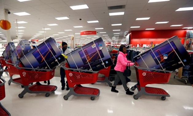 Thanksgiving Day holiday shoppers line up with television sets on discount at the Target retail store in Chicago, Illinois, November 28, 2013. REUTERS/Jeff Haynes