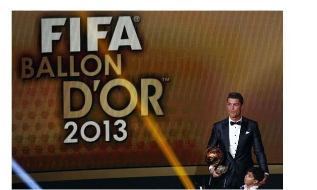Portugal's Cristiano Ronaldo holds his trophy with his son Cristiano Ronaldo Jr after being awarded the FIFA Ballon d'Or 2013 in Zurich January 13, 2014. REUTERS