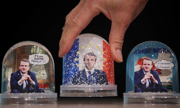 Snowglobes depicting French President Emmanuel Macron, made by Bruot company in eastern France, are displayed at a store in Paris, France, November 17, 2017. REUTERS/Christian Hartmann