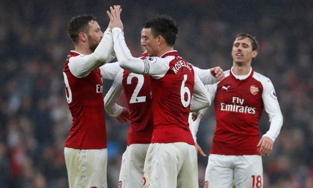 Premier League - Arsenal vs Tottenham Hotspur - Emirates Stadium, London, Britain - November 18, 2017 Arsenal's Shkodran Mustafi and Laurent Koscielny celebrate after the match Action Images - Reuters