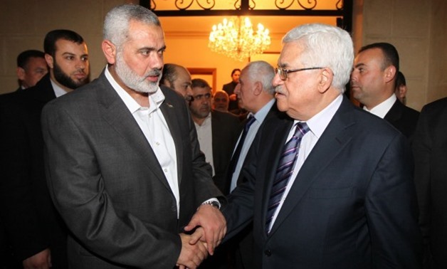 Press Photo - Hamas's leader Ismail Haniyeh (L) and Palestinian President Mahmoud Abbas 