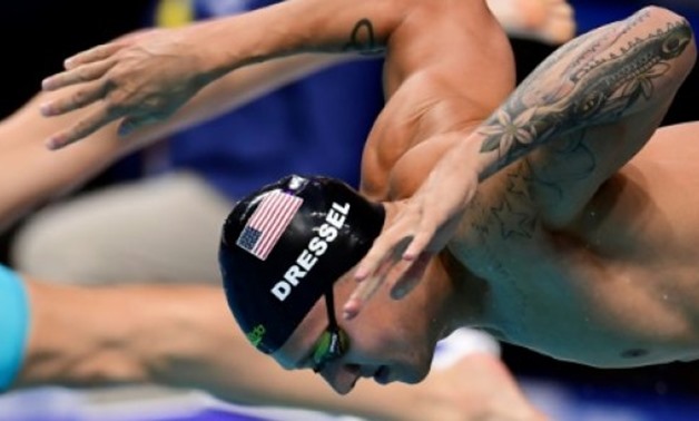  AFP/File | US swimmer Caeleb Dressel emerged from the shadow of his idol Michael Phelps in Budapest becoming the first swimmer to win three world championships gold medals in a single day
