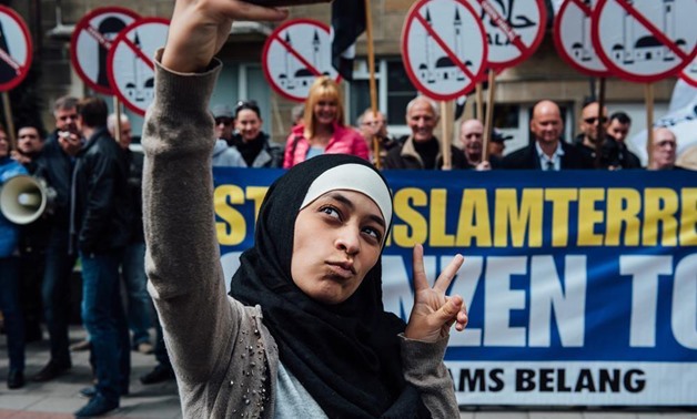 A young Muslim woman’s audacious selfie in front of anti-Islamic protesters earned her global acclaim. Twitter
