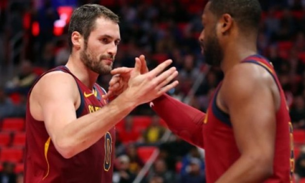 Kevin Love of the Cleveland Cavaliers celebrates a first half basket with Dwyane Wade against the Detroit Pistons - AFP/GETTY