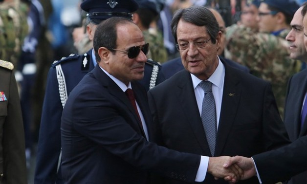 Cypriot President Nicos Anastasiades (R) and Egyptian President Abdel Fattah al-Sisi are seen during a welcome ceremony the Presidential Palace in Nicosia, Cyprus November 20, 2017. REUTERS/Yiannis Kourtoglou