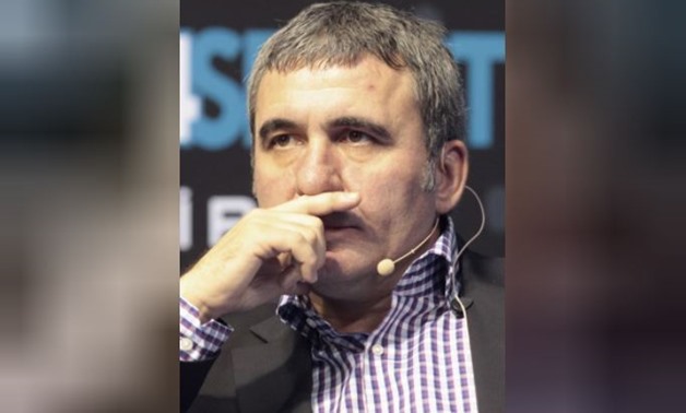Former Romanian soccer player Gheorghe Hagi pauses during a news conference at the Sports Congress and Exhibition at Aspire Dome in Doha November 13, 2012. REUTERS/Fadi Al-Assaad