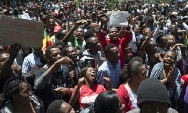 © AFP / by Reagan MASHAVAVE | President Robert Mugabe has ruled Zimbabwe with a rod of iron since independence in 1980. But the gag on protest has now been lifted -- tens of thousands have taken to the streets to demand his departure