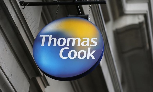 A sign is seen outside a Thomas Cook shop in central London, November 26, 2014. REUTERS/Suzanne Plunkett/File Photo

