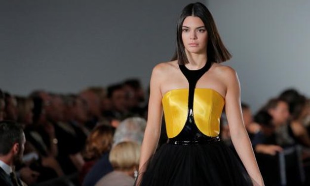 Model Kendall Jenner presents a creation from the Ralph Lauren Spring/Summer 2018 collection. REUTERS/Andrew Kelly September 14, 2017 07:30pm EDT