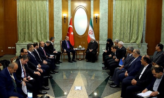 Turkey's President Tayyip Erdogan meets with Iran's President Hassan Rouhani in Sochi, Russia, November 22, 2017. Yasin Bulbul/Turkish Presidential Palace/Handout via REUTERS ATTENTION EDITORS - THIS PICTURE WAS PROVIDED BY A THIRD PARTY. NO RESALES. NO A