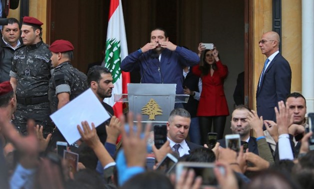 Lebanese Prime Minister Saad Hariri greets his supporters upon his arrival at his home in Beirut on November 22, 2017 after nearly three weeks of absence during which he announced his shock resignation from Saudi Arabia. AFP