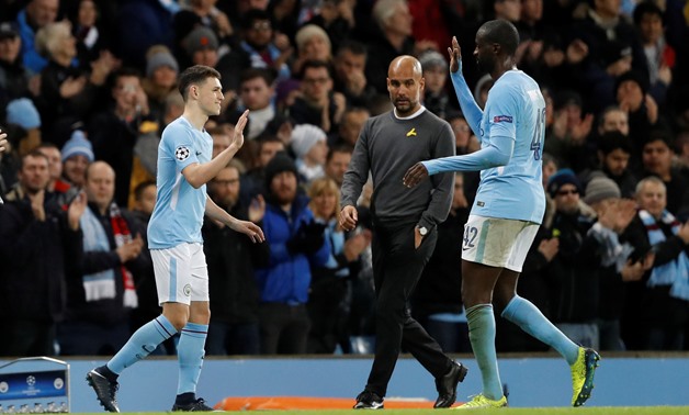 Soccer Football - Champions League - Manchester City vs Feyenoord - Etihad Stadium, Manchester, Britain - November 21, 2017 Manchester City's Phil Foden comes on as a substitute to replace Yaya Toure as manager Pep Guardiola looks on Action Images - Reute