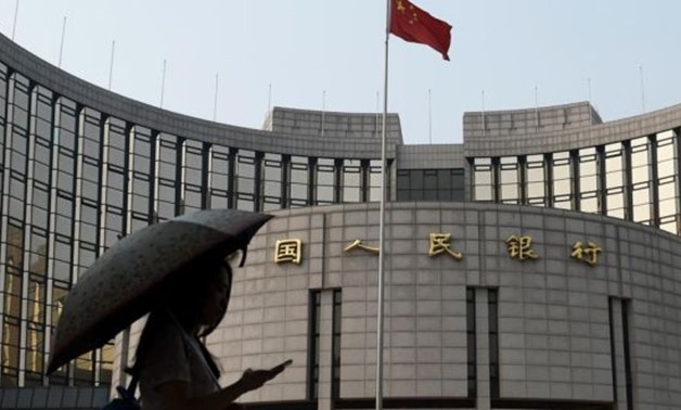 The People’s Bank of China in Beijing: the bank, the ministry of housing and urban-rural development and the ministry of finance have lowered the downpayment required on a second apartment to 20 per cent - REUTERS
