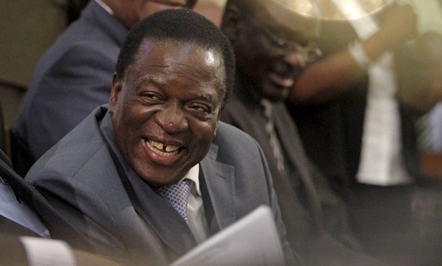 Zimbabwe Vice-President Emmerson Mnangagwa listens as President Robert Mugabe (not pictured) delivers his state of the nation address to the country's parliament in Harare, August 25, 2015. REUTERS/Philimon Bulawayo