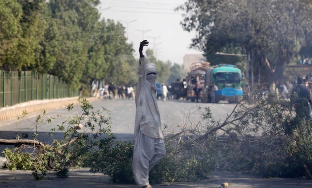 A supporter of the Tehreek-e-Labaik Pakistan, an Islamist political party, gestures after blocking the main road leading to the airport in Karachi, Pakistan November 25, 2017. REUTERS/Akhtar Soomro
