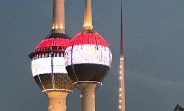 FILE - Kuwait lit its towers with lights of Egypt's flag