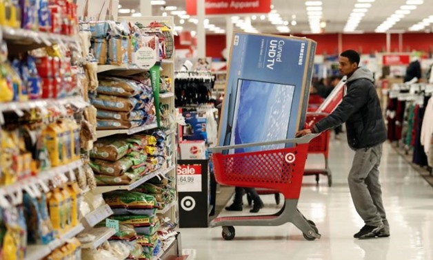 Customers push their shopping carts after making a purchase at Target in Chicago, Illinois. REUTERS/Kamil Krzaczynski
