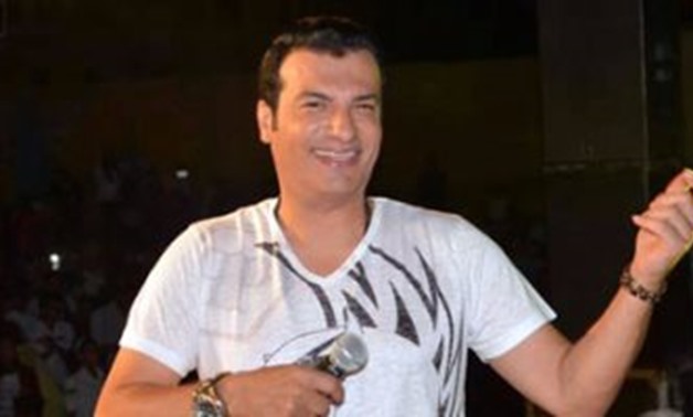FILE – The Egyptian singer Ehab Tawfik singing in a concert