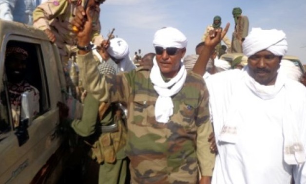 © AFP/File | Musa Hilal (C), the leader of the Arab Mahamid tribe in Sudan's Darfur region, salutes followers in Nyala, the capital of South Darfur state, on December 7, 2013