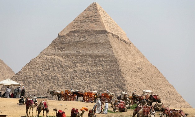 FILE – People gathering at the Giza Pyramids