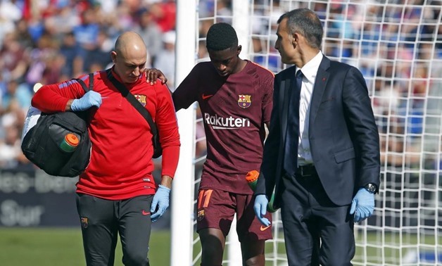 FILE – Dembélé walking off the pitch after his injury in the Getafe game