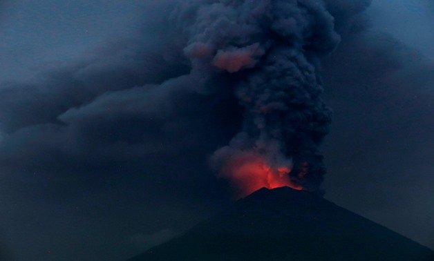 Glowing light of hot lava is seen during the eruption of Mount Agung as seen from Amed in Karangasem, Bali, Indonesia. REUTERS/Johannes P. Christo

