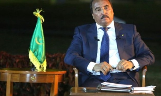 Mauritania's President Mohamed Ould Abdel Aziz added two red bands to the country's flag to mark a series of constitutional changes passed by referendum in August - AFP/File 