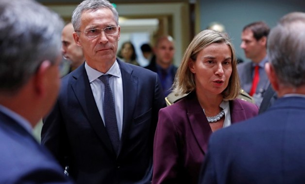 NATO Secretary General Jens Stoltenberg and European Union Foreign Policy Chief Federica Mogherini attend a European Union defence ministers' meeting in Brussels, Belgium, November 13, 2017. REUTERS/Yves Herman