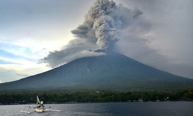 Mount Agung, which looms over one of the world's top holiday spots, could produce a thunderous eruption at any moment, officials have warned, forcing the main airport to be shut since Monday