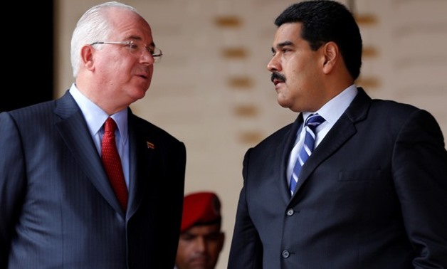 FILE PHOTO: Venezuela's President Nicolas Maduro speaks with Venezuela's Foreign Minister Rafael Ramirez during a ceremony in Caracas - REUTERS
