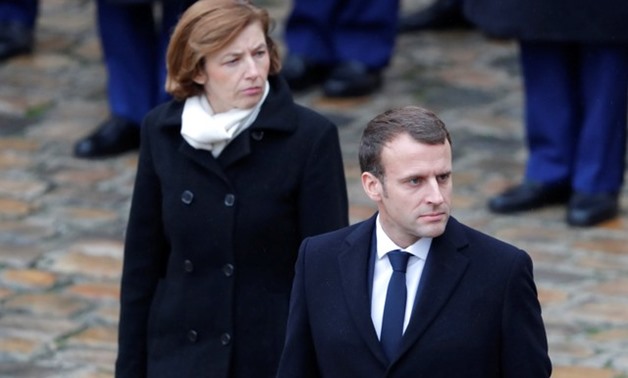 French President Emmanuel Macron (R) and French Minister of the Armed Forces Florence Parly (L) attend a military award ceremony in the courtyard of the Invalides in Paris, France, November 27, 2017. REUTERS/Charles Platiau

