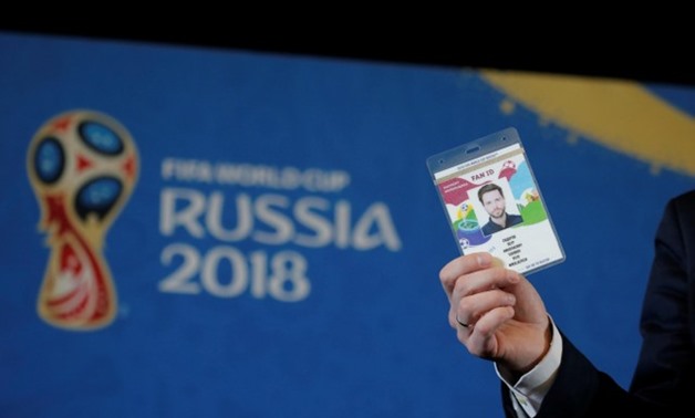 A man shows an example FAN ID for the 2018 FIFA World Cup Russia during an event in Moscow, Russia, November 30, 2017. REUTERS/Maxim Shemetov
