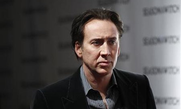 Cast member Nicolas Cage arrives for the premiere of the film "Season of the Witch" in New York in this January 4, 2011 file photo. REUTERS