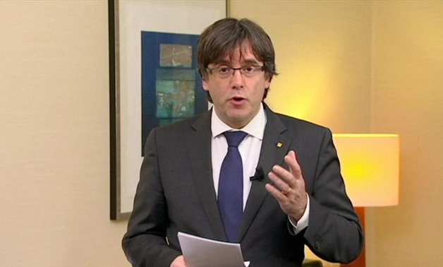 Sacked Catalan President Carles Puigdemont makes a statement in this still image from video calling for the release of "the legitimate government of Catalonia", after a Spanish judge ordered nine Catalan secessionist leaders to be held in custody pending 