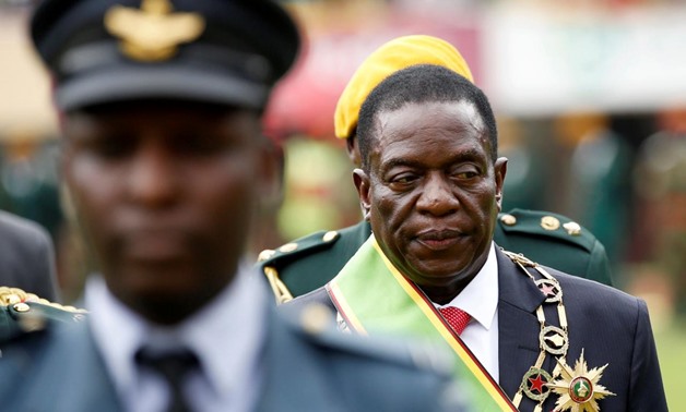 Emmerson Mnangagwa walks after he was sworn in as Zimbabwe's president in Harare, Zimbabwe, November 24, 2017. REUTERS/Siphiwe Sibeko
