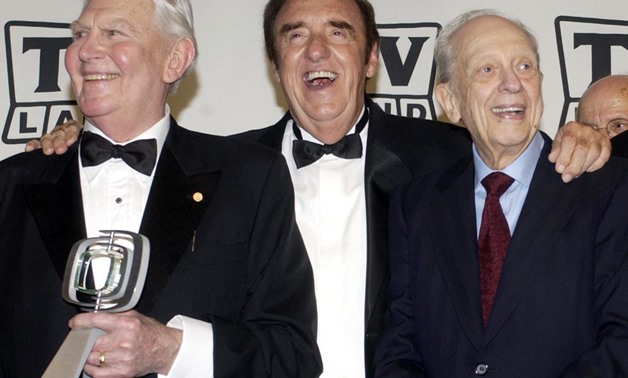 Andy Griffith, Jim Nabors and Don Knotts, cast members in "The Andy Griffith Show," pose backstage after accepting the Legend Award for their series during a taping of the second annual TV Land Awards in Hollywood, California, U.S., March 7, 2004 - REUTER
