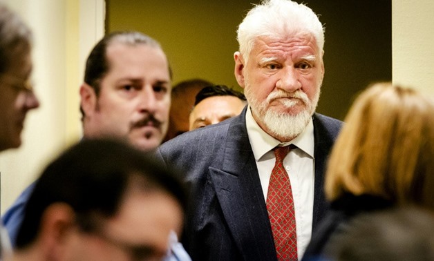 Robin van Lonkhuijsen Croatian former general Slobodan Praljak appeared to drink poison during a hearing at a UN war crimes court - AFP
