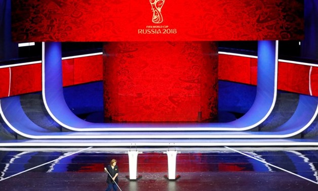 2018 FIFA World Cup Draw - State Kremlin Palace, Moscow, Russia - December 1, 2017 Cleaner cleans the stage ahead of the draw REUTERS/Kai Pfaffenbach