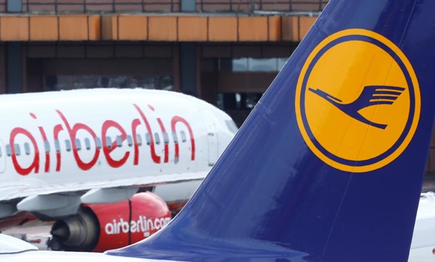 A Lufthansa airliner parks next to the Air Berlin aircraft at Tegel airport in Berlin, Germany, October 12, 2017. REUTERS/Hannibal Hanschke