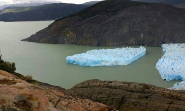 © CONAF/AFP | A large piece detaches from the Grey Glacier in Chile's far southern Patagonia region, as seen on November 28, 2017 in this handout released by Chile's National Forest Corporation (CONAF)