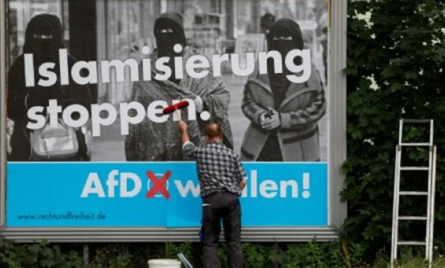 © AFP/File / by Deborah COLE | An AfD poster reads "Stop Islamisation"