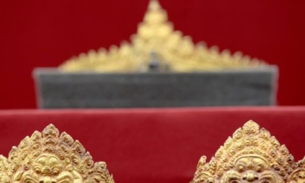 © AFP | The set of Angkorian-era gold jewellery includes a crown, earrings, armbands and a chest ornament